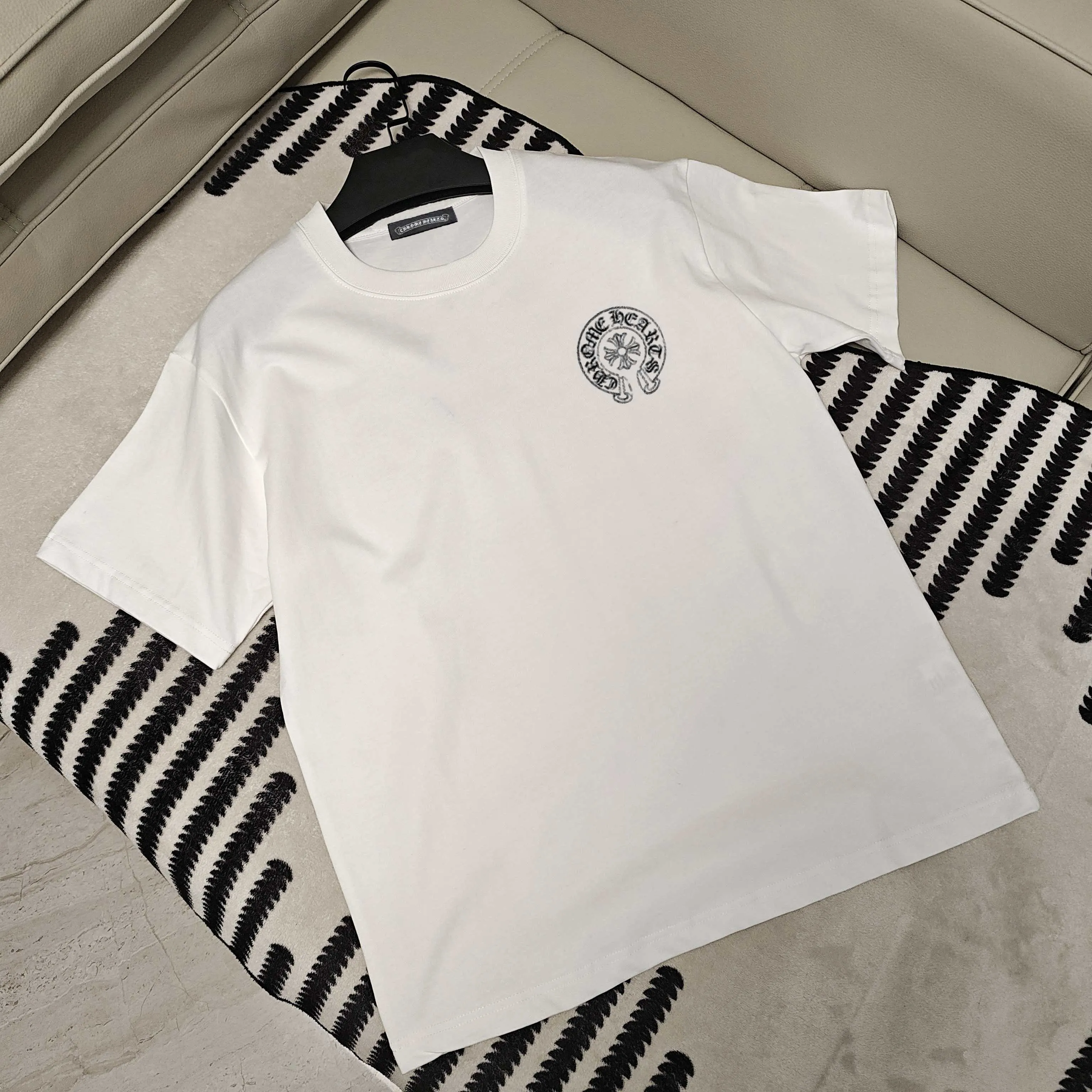 🅿️190 Crow Heart’s new summer T-shirt! This Sanskrit cross printed round neck short sleeves is simply a must-have for fashionistas. Salona cotton fabric is super comfortable, soft and skin-friendly, and has excellent breathability, making it perfect for summer wear. The Sanskrit cross print design on it is amazing, full of mystery and high-end, and the details are so exquisite that it makes people scream. It is worthy of Kroxin, and it vividly interprets the trend and personality. The loose fit is super friendly to all body shapes, covers the flesh and is comfortable, and looks good no matter how you wear it. Pair it with jeans and you'll look cool on the street. Pair it with sweatpants and you'll instantly look energetic and trendy. When you wear it and go out, you will feel like you are the spokesperson of fashion, and it will definitely turn heads. Color: black, white Size: S-2XL